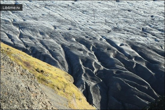 A glacier slowly flowing downward