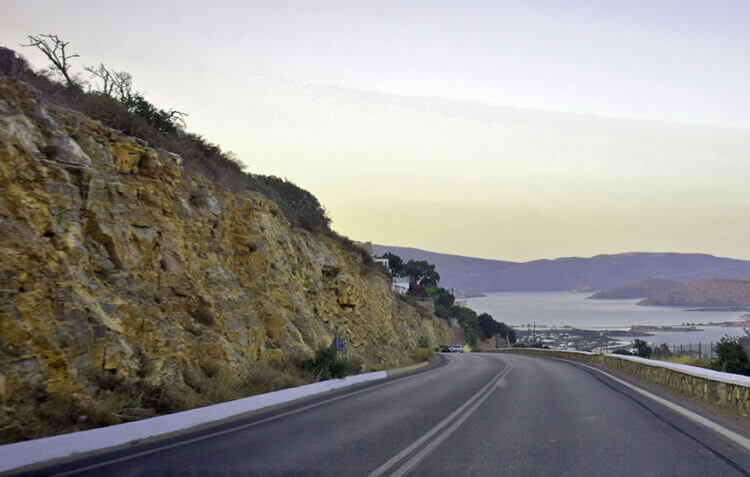 Wear of highway asphalt by car wheels as an example of sliding and rolling friction